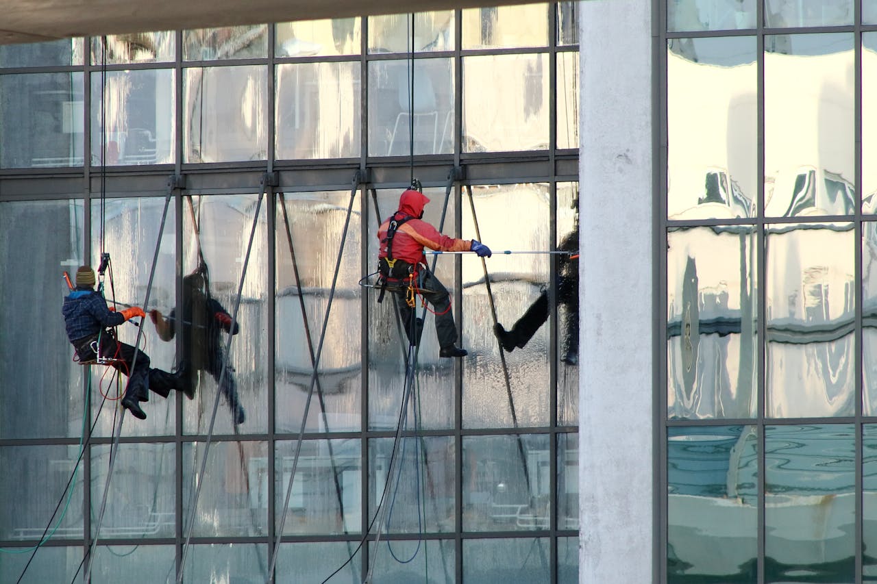Professional window cleaners working on a skyscrapers exterior in Saint Petersburg, Russia.